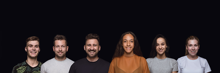 Image showing Group portrait of emotional people on black studio background