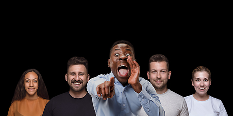 Image showing Group portrait of emotional people on black studio background