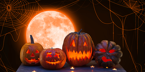 Image showing Scary pumpkin on orange background, the night of fear