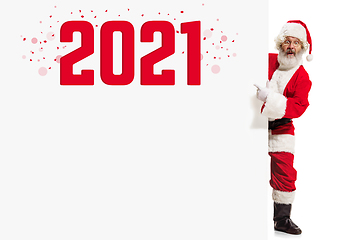 Image showing Emotional Santa Claus in eyewear greeting with New Year 2021 and Christmas. Copyspace