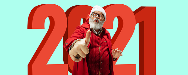 Image showing Emotional Santa Claus in eyewear greeting with New Year 2021 and Christmas. Copyspace