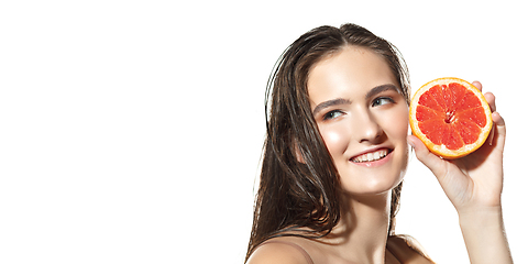 Image showing Beautiful face of young woman with clean fresh skin. Flyer with copyspace
