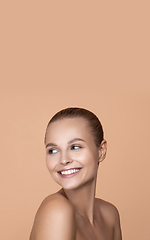 Image showing Beautiful face of young woman with clean fresh skin. Flyer with copyspace