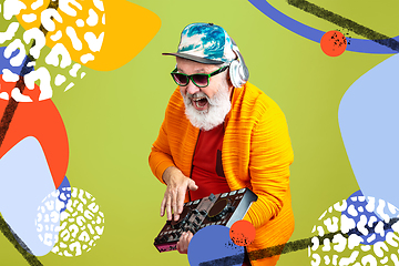 Image showing Senior hipster man using devices, gadgets. Tech and joyful elderly lifestyle concept. Bright illustrated background