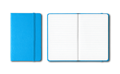 Image showing Cyan blue closed and open lined notebooks isolated on white