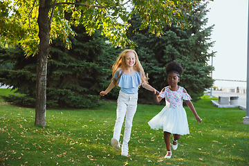 Image showing Interracial kids, friends, girls playing together at the park in summer day