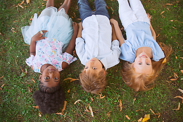 Image showing Interracial group of kids, girls and boys playing together at the park in summer day