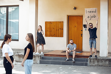 Image showing Dude with sign - man stands protesting things that annoy him