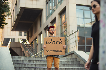 Image showing Dude with sign - man stands protesting things that annoy him