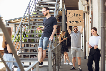 Image showing Dude with sign - man stands protesting things that annoy him