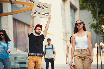 Image showing Dude with sign - man stands protesting things that annoy him