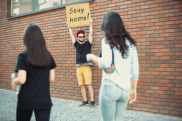 Image showing Dude with sign - man stands protesting things that annoy him