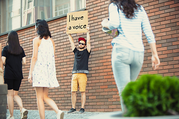 Image showing Dude with sign - man stands protesting things that annoy him