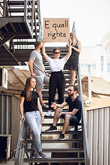 Image showing Dude with sign - woman stands protesting things that annoy him