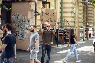 Image showing Dude with sign - man stands protesting things that annoy him