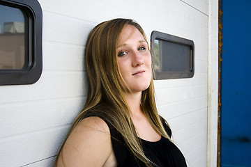 Image showing Urban Girl in a Black Dress Looking At the Camera