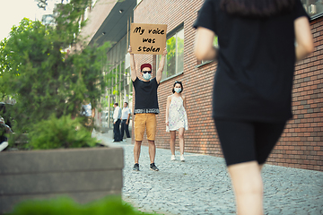 Image showing Dude with sign - man stands protesting things that annoy him