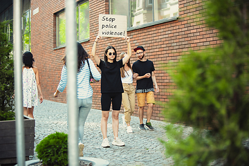 Image showing Dude with sign - woman stands protesting things that annoy him