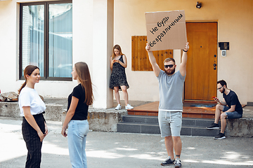 Image showing Dude with sign - man stands protesting things that annoy him