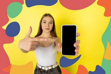 Image showing Caucasian teens girl portrait isolated on bright, modern illustrated background.