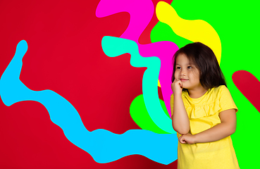 Image showing Asian little girl portrait isolated on bright, modern illustrated background.