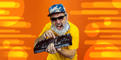 Image showing Senior hipster man using devices, gadgets. Tech and joyful elderly lifestyle concept. Bright illustrated background