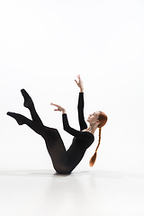 Image showing Young and graceful ballet dancer in minimal black style isolated on white studio background