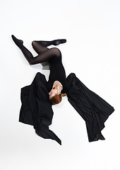 Image showing Young and graceful ballet dancer in minimal black style isolated on white studio background