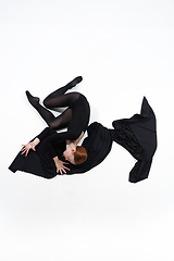 Image showing Young and graceful ballet dancer in minimal black style isolated on white studio background