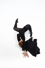 Image showing Young and graceful ballet dancer in minimal black style isolated on white studio background