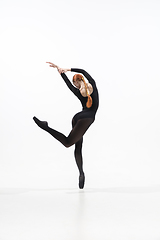 Image showing Young and graceful ballet dancer in minimal black style isolated on white studio background