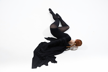 Image showing Young and graceful ballet dancer in minimal black style isolated on white studio background