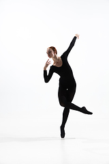 Image showing Young and graceful ballet dancer in minimal black style isolated on white studio background