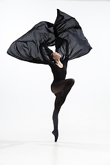 Image showing Young and graceful ballet dancer in minimal black style isolated on white studio background