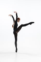 Image showing Young and graceful ballet dancer in minimal black style isolated on white studio background