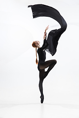 Image showing Young and graceful ballet dancer in minimal black style isolated on white studio background