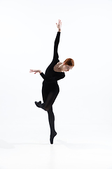 Image showing Young and graceful ballet dancer in minimal black style isolated on white studio background