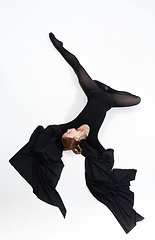 Image showing Young and graceful ballet dancer in minimal black style isolated on white studio background