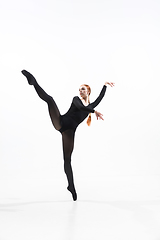 Image showing Young and graceful ballet dancer in minimal black style isolated on white studio background