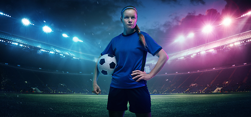 Image showing Football or soccer player on full stadium and flashlights background