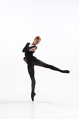 Image showing Young and graceful ballet dancer in minimal black style isolated on white studio background