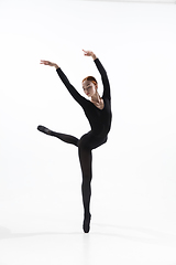 Image showing Young and graceful ballet dancer in minimal black style isolated on white studio background