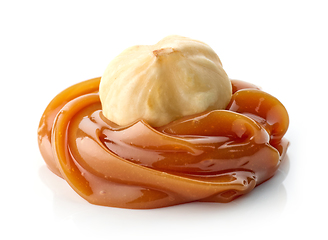 Image showing hazelnut in melted caramel