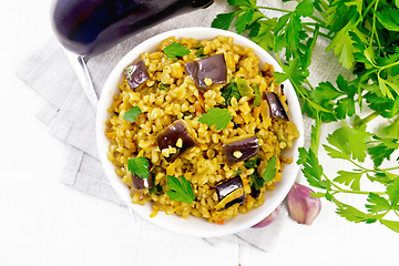 Image showing Bulgur with eggplant in bowl on board top