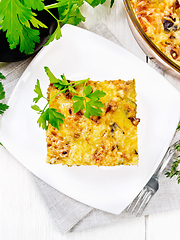 Image showing Casserole of meat and eggplant in plate on light board top