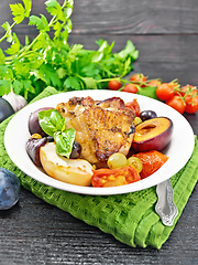 Image showing Chicken with fruits and tomatoes in plate on napkin