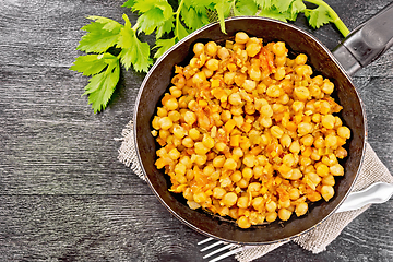 Image showing Chickpeas stewed with vegetables in pan on board top