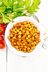 Image showing Chickpeas with vegetables stewed in plate on board top