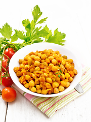 Image showing Chickpeas with vegetables stewed in plate on white board