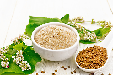 Image showing Flour buckwheat brown in bowl on white board